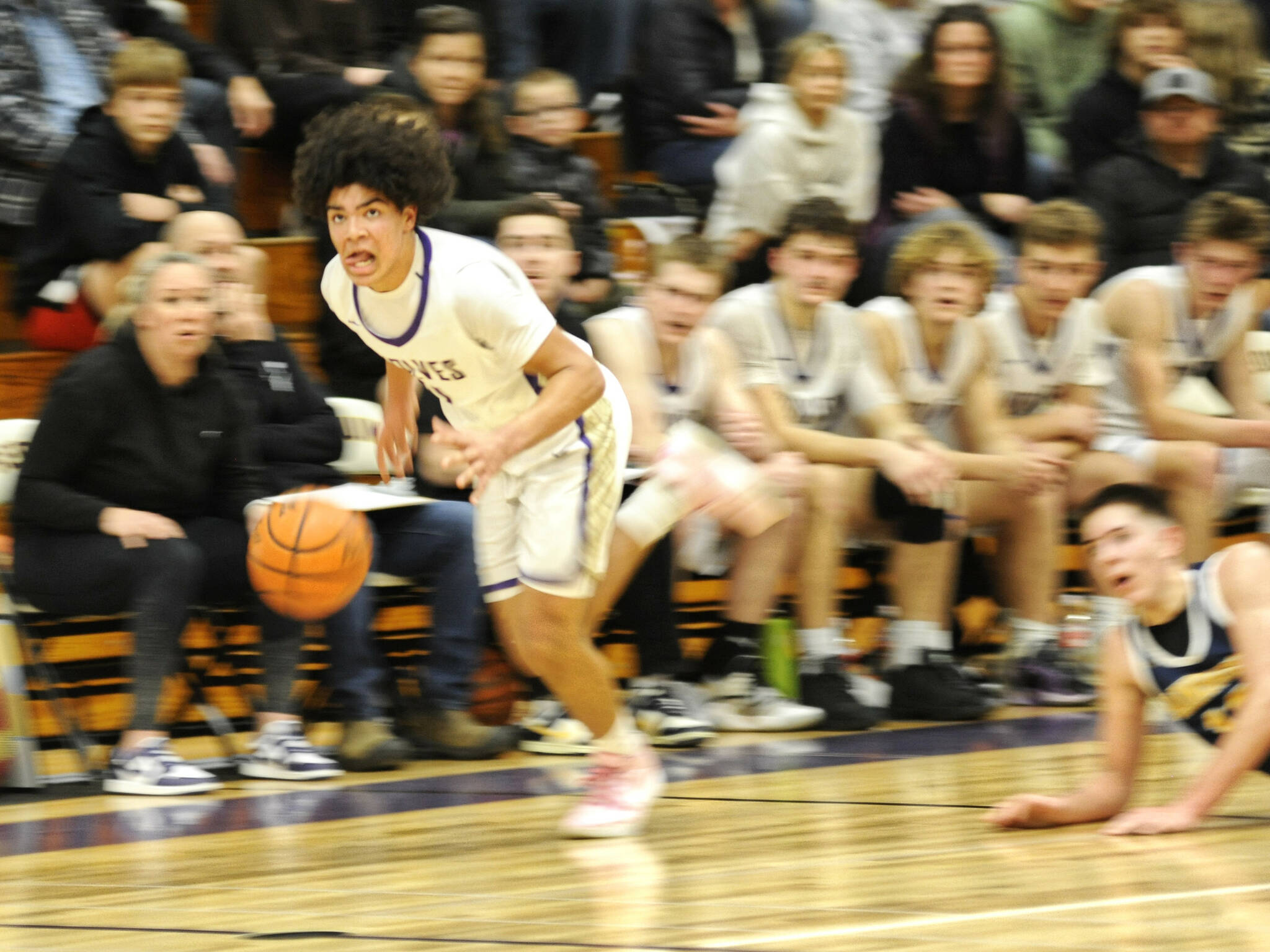 Sequim Gazette photo by Matthew Nash
Jericho Julmist makes one of his two steals against Bainbridge on Dec. 13.