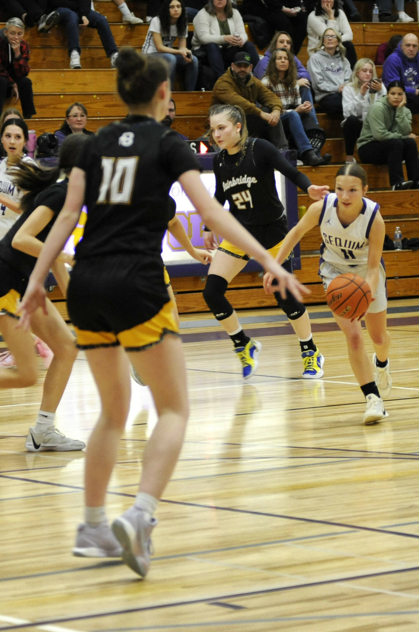 Sequim Gazette photo by Matthew Nash/ Sequim’s Kylie Winter drives up court on Dec. 13 against Bainbridge.