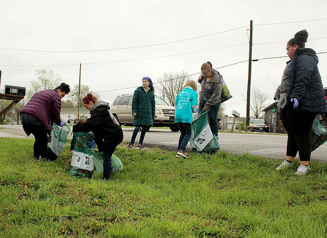 Photo courtesy Scout Troops 1498 and 7498
Scouts, seen here picking up trash for a service project, have set fundraisers to help families pay for scouting expenses at Goodness Tea through the end of 2024. They also seek Christmas trees to recycle for a fee.