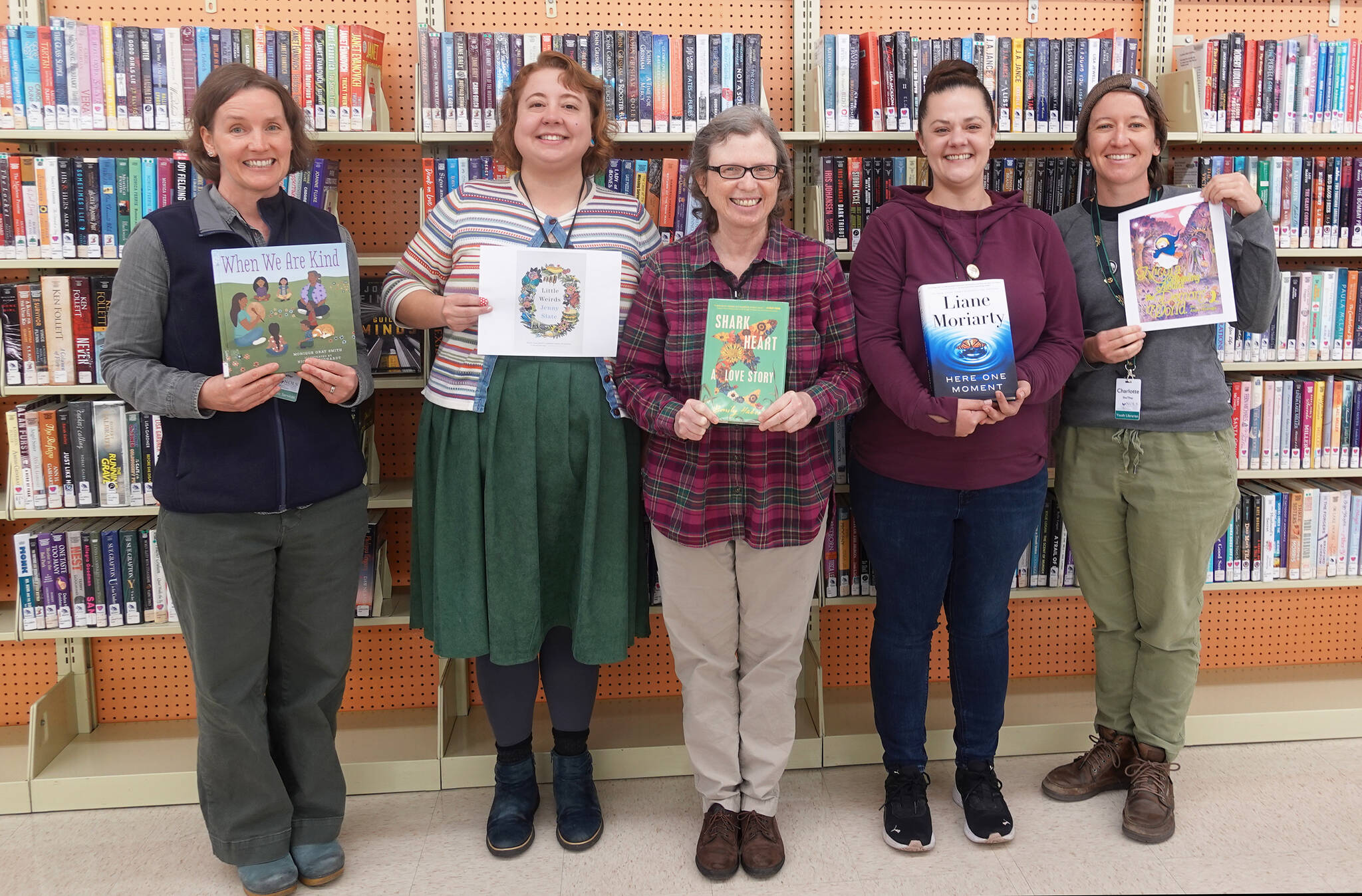 Photo courtesy North Olympic Library System/ Staff with the Sequim Library, from left, Public Services Specialists Amber Kleefeld, Anna Foster and Ellen Schvetz, Public Services Lead Annie Brooker and Youth Services Librarian Charlotte McGrew, provide some of their favorite reads for 2024. Not pictured are Older Adult Services Librarian Corrina Desmarais and Public Services Specialist Dana Seevers.