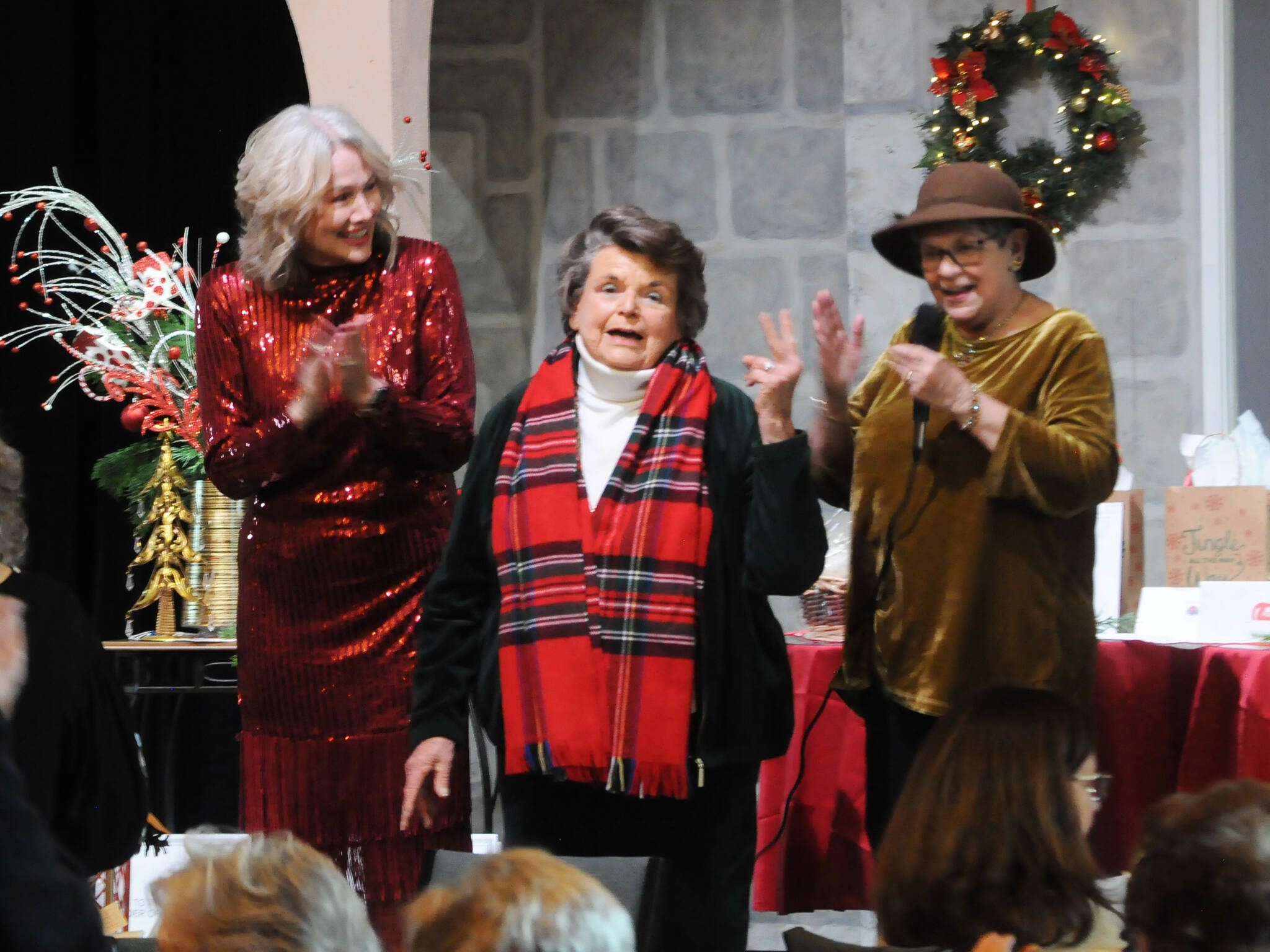 Sequim Gazette photo by Matthew Nash
Emma “Em” Hutchins, center, a founding member of the Sequim-Dungeness Hospital Guild, congratulates the all-volunteer organization for their decades of work supporting community health agencies. She stands with Sandra Berryhill-Huish, left, and Randi Cooper, on right. Hutchins said what the Guild does is “just remarkable.”