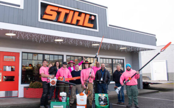 Alicia Liggins, fourth adult from the left, and her husband Darrin Liggins, fourth from right, enjoy a light moment with their Liggins Landscaping & Maintenance crew. From left, they are Jayden Tejano, Luci Bench, Isaac Freeman, John Hjorten, Jerrod Little, Frank Portello Jr., Jamie Holm and Carter Holm. (Photo by Monica Berkseth)