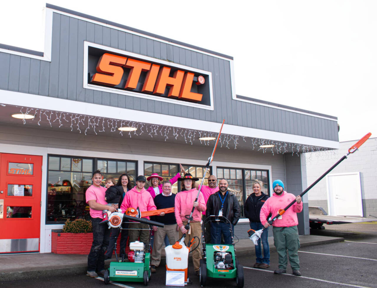 Alicia Liggins, fourth adult from the left, and her husband Darrin Liggins, fourth from right, enjoy a light moment with their Liggins Landscaping & Maintenance crew. From left, they are Jayden Tejano, Luci Bench, Isaac Freeman, John Hjorten, Jerrod Little, Frank Portello Jr., Jamie Holm and Carter Holm. (Photo by Monica Berkseth)