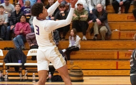 Sequim Gazette photo by Emily Matthiessen
Solomon Sheppard drives against W.F. West on Dec. 28.