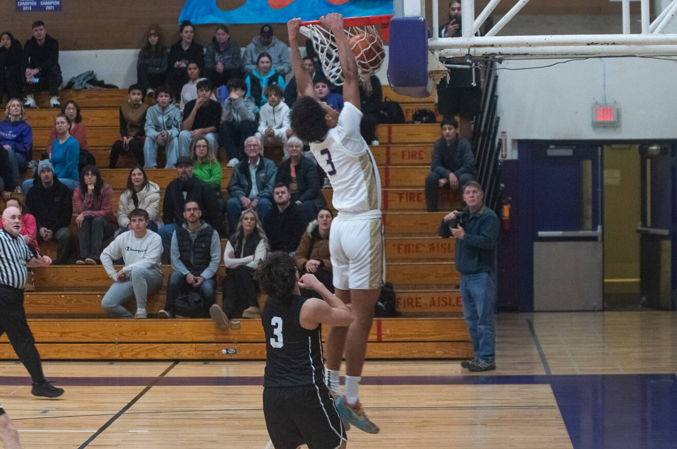 Sequim Gazette photo by Emily Matthiessen
Sequim’s Solomon Sheppard dunks against North Kitsap on Jan. 10 during a 74-46 victory to remain unbeaten on the season.