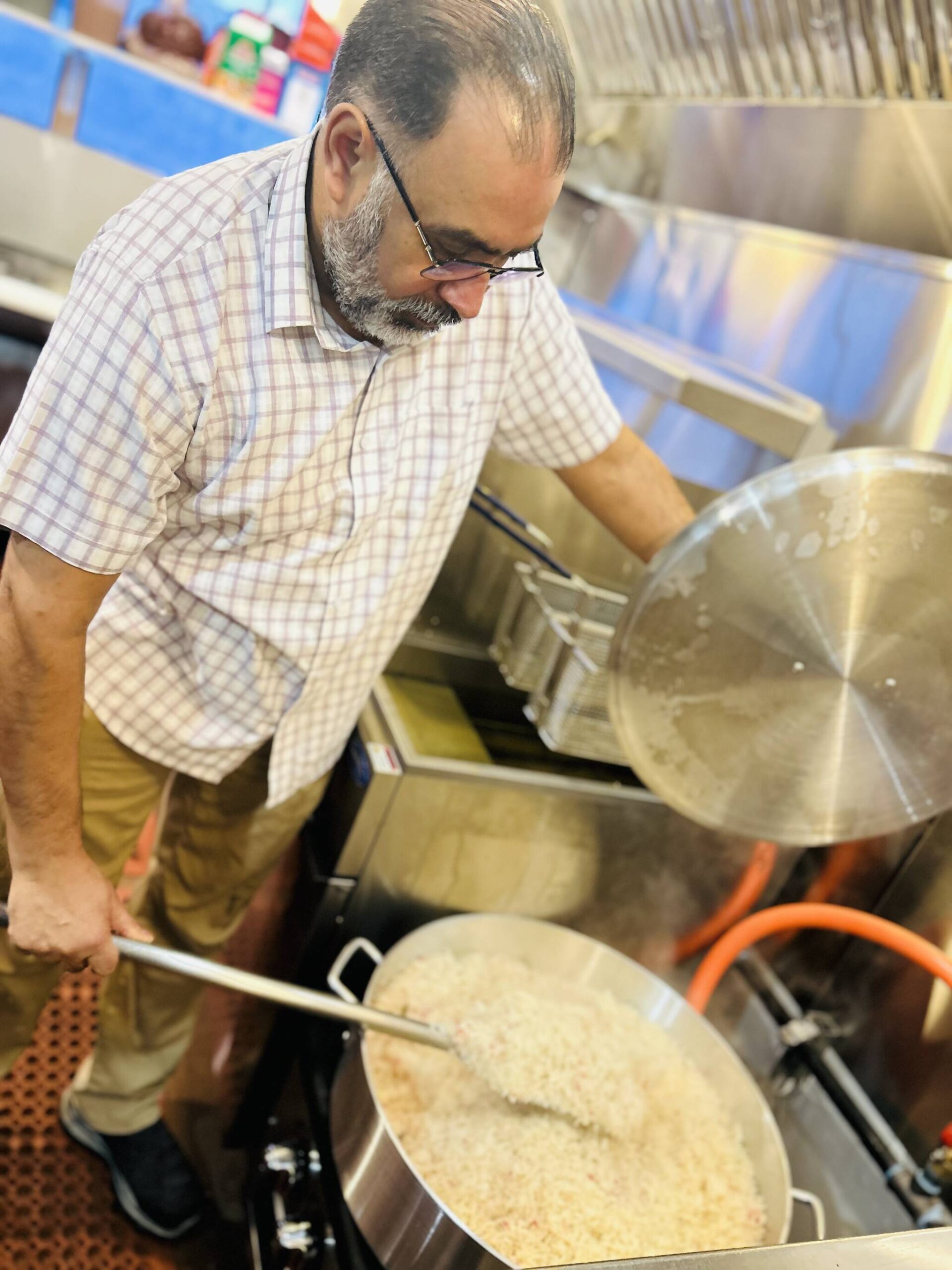 Sequim Gazette photo by Kathy Cruz
Hardy’s Market co-owner Harvir Sangha stirs a large pot of freshly-made rice in the store’s new, $100,000 kitchen.